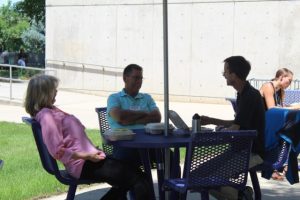 Group of people sitting at a table.