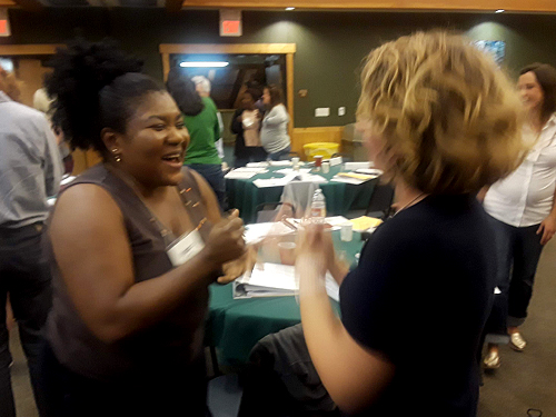 two women happy talking with each other.